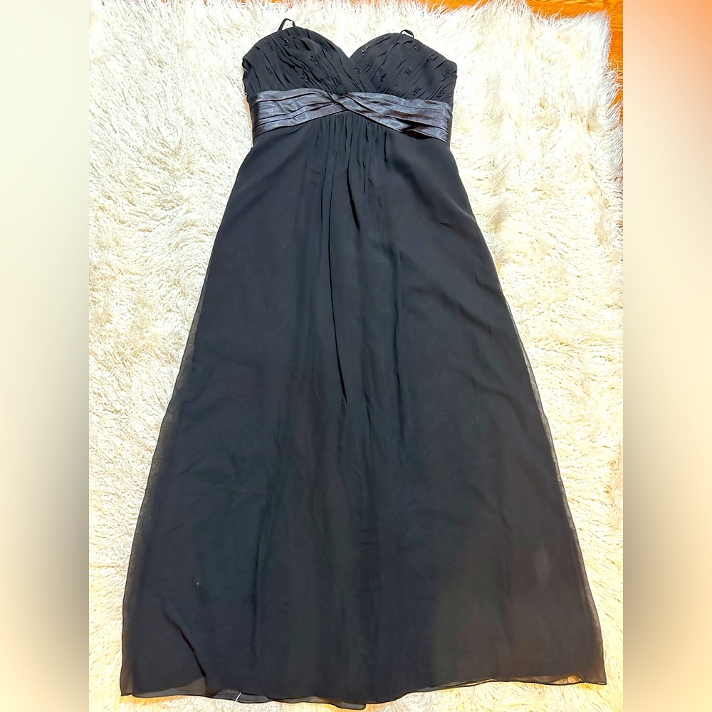 Elegant black spaghetti strap gown.